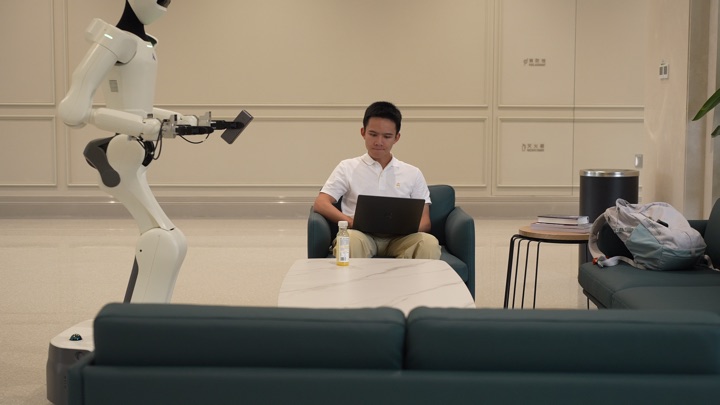 The robot navigates and manipulates in sequence to retrieve and deliver a power bank, frame 3 of 3.