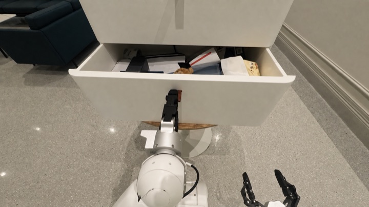 The robot searches cabinet drawers for a power bank absent from the scene graph, frame 2 of 3.