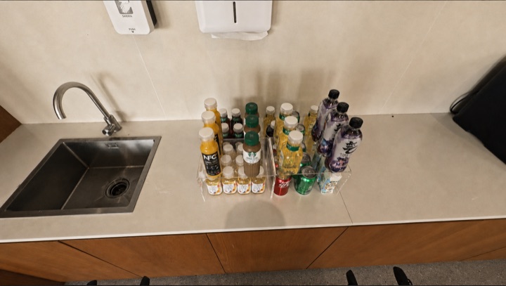 The robot asks the user for an alternative when the requested water is unavailable, then retrieves the selected drink, frame 1 of 3.