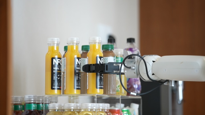 The robot asks the user for an alternative when the requested water is unavailable, then retrieves the selected drink, frame 3 of 3.